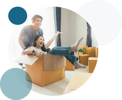 young couple playing with a moving box